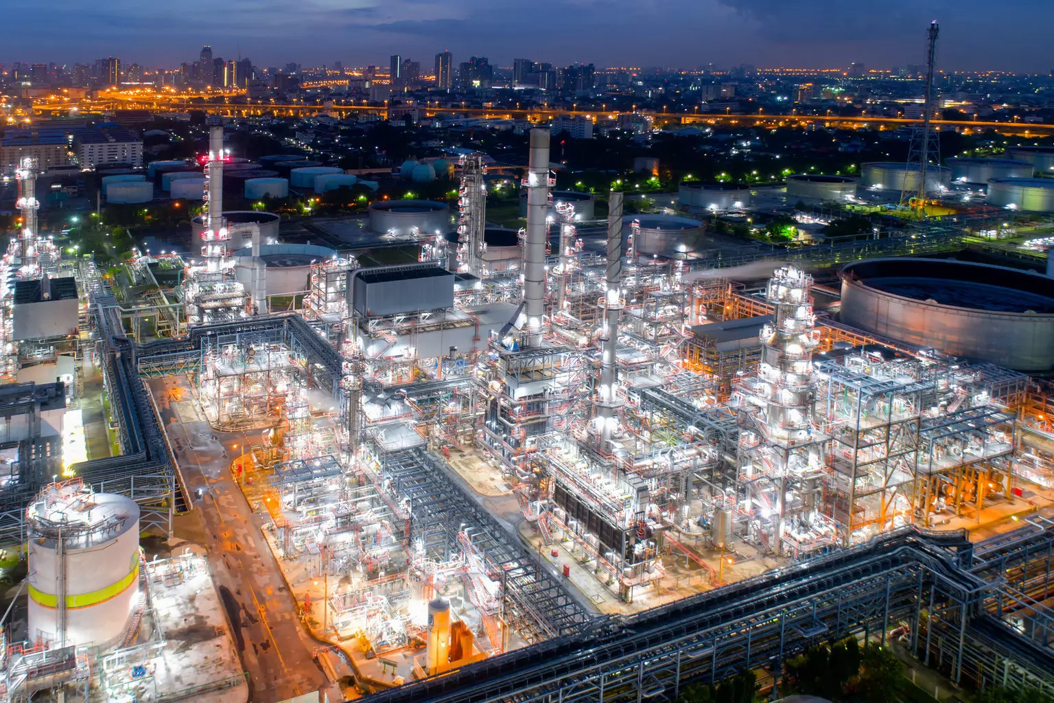 Aerial view of twilight of oil refinery ,Shot from drone of Oil refinery and Petrochemical plant at dusk , Bangkok, Thailand